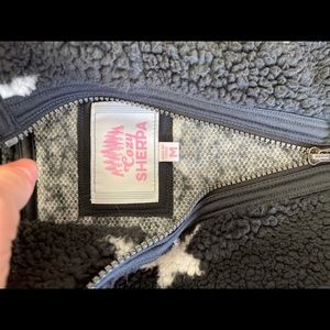 Black and white half zip Sherpa